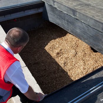 Underground wood chip hopper