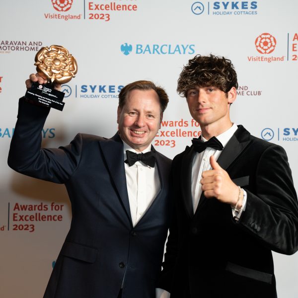 Daniel and George Holder with their VisitEngland Award for Camping, Glamping and Holiday Park of the Year crowning them the Best in England!